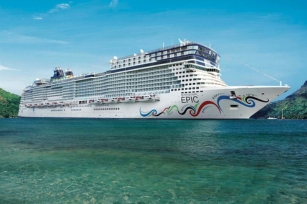 Close up image of the Norwegian Epic cruise shup featuring the green/blue waters