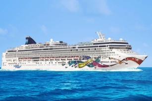 image of Norwegian Jewel cruise ship cruising through the deep blue waters