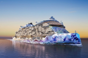 image of Norwegian Luna coloured in vibrant colours cruising through the purple featuring the sunset in the background
